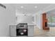 Open concept living room and kitchen with a fireplace, bright and spacious at 45 S Edgemon Ave, Winter Springs, FL 32708