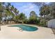 Backyard pool surrounded by concrete and trees with a shed in the background at 45 S Edgemon Ave, Winter Springs, FL 32708