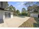 A backyard swimming pool is surrounded by a concrete patio, offering a refreshing outdoor retreat next to the home at 45 S Edgemon Ave, Winter Springs, FL 32708