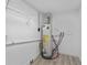Utility room featuring water heater and wire shelving for storage at 45 S Edgemon Ave, Winter Springs, FL 32708