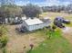 Aerial view of home on acreage with pond and outbuildings at 4771 Deen Still Rd, Polk City, FL 33868