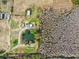 Aerial view of property with pond, buildings, and surrounding land at 4771 Deen Still Rd, Polk City, FL 33868