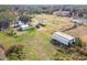 Aerial view of property showing home, pond, and large lot at 4771 Deen Still Rd, Polk City, FL 33868