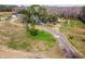Aerial view of property showing home and large lot with pond at 4771 Deen Still Rd, Polk City, FL 33868