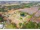Aerial view highlighting property lines and various structures on the land at 4771 Deen Still Rd, Polk City, FL 33868