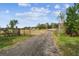 Gravel driveway leading to home and property at 4771 Deen Still Rd, Polk City, FL 33868