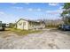 Single story home on a gravel driveway at 4771 Deen Still Rd, Polk City, FL 33868