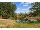 Serene pond with lush vegetation and a truck parked nearby at 4771 Deen Still Rd, Polk City, FL 33868