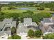 Aerial view of house, pool and golf course at 510 Golfpark Dr, Celebration, FL 34747