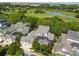 Aerial view showing house, pool, and golf course at 510 Golfpark Dr, Celebration, FL 34747