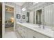 Shared bathroom with double vanity and floral wallpaper at 510 Golfpark Dr, Celebration, FL 34747