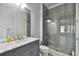 Bathroom with gray tile shower and marble vanity at 510 Golfpark Dr, Celebration, FL 34747