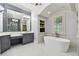 Elegant bathroom featuring a soaking tub and double vanity at 510 Golfpark Dr, Celebration, FL 34747