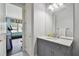 Bathroom with gray vanity and access to home gym at 510 Golfpark Dr, Celebration, FL 34747