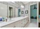 Shared bathroom with double vanity and floral wallpaper at 510 Golfpark Dr, Celebration, FL 34747