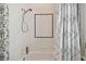 Bathroom with shower/tub combo and white tile at 510 Golfpark Dr, Celebration, FL 34747