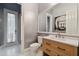 Modern bathroom with light wood vanity and large mirror at 510 Golfpark Dr, Celebration, FL 34747