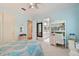 Bedroom with white built-in desk and light blue walls at 510 Golfpark Dr, Celebration, FL 34747