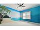 Bedroom with beach mural and ceiling fan at 510 Golfpark Dr, Celebration, FL 34747