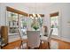 Bright breakfast nook with glass table and pool view at 510 Golfpark Dr, Celebration, FL 34747