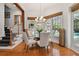 Bright breakfast nook with a glass table and pool view at 510 Golfpark Dr, Celebration, FL 34747