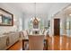Elegant dining room featuring hardwood floors, chandelier, and sideboard at 510 Golfpark Dr, Celebration, FL 34747