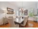 Elegant formal dining room features a large table, chandelier, and hardwood floors at 510 Golfpark Dr, Celebration, FL 34747