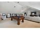 Game room featuring a pool table, comfortable seating, and a large TV at 510 Golfpark Dr, Celebration, FL 34747