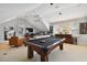 Game room with pool table, sectional sofa, and framed jerseys at 510 Golfpark Dr, Celebration, FL 34747