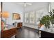Home office with hardwood floors and large windows at 510 Golfpark Dr, Celebration, FL 34747