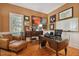 Home office with hardwood floors and comfortable seating at 510 Golfpark Dr, Celebration, FL 34747
