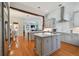 Spacious kitchen boasts modern cabinetry, stainless steel appliances, and an island at 510 Golfpark Dr, Celebration, FL 34747