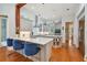 Open kitchen with breakfast bar and seating for three at 510 Golfpark Dr, Celebration, FL 34747