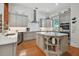 Bright kitchen with white quartz countertops and stainless steel appliances at 510 Golfpark Dr, Celebration, FL 34747