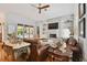 Living room with leather sofas and pool access at 510 Golfpark Dr, Celebration, FL 34747