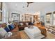 Open living room with sectional sofa and large artwork at 510 Golfpark Dr, Celebration, FL 34747