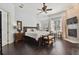 Main bedroom with fireplace and dark hardwood floors at 510 Golfpark Dr, Celebration, FL 34747
