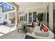 Outdoor kitchen and patio furniture under covered area at 510 Golfpark Dr, Celebration, FL 34747