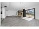 Finished basement rec room with stone fireplace and sliding glass doors at 5438 San Luis Dr, Orlando, FL 32807