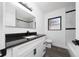 Modern bathroom with dark countertop, stylish vanity, and black and white tiled shower at 5438 San Luis Dr, Orlando, FL 32807
