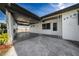 View of the side of the property and the front entrance at 5438 San Luis Dr, Orlando, FL 32807