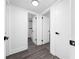Bright hallway showcasing modern doors and trim, leading to various rooms in the home at 5438 San Luis Dr, Orlando, FL 32807