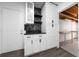 Stylish wet bar with marble backsplash and open access to a utility room at 5438 San Luis Dr, Orlando, FL 32807