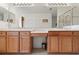 Bathroom features double sinks and a large mirror at 663 Shorehaven Dr, Poinciana, FL 34759