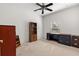 This bedroom features a ceiling fan, window with blinds, and ample room for furnishings at 663 Shorehaven Dr, Poinciana, FL 34759