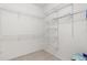 Walk-in closet with wire shelving is ready for storage at 663 Shorehaven Dr, Poinciana, FL 34759