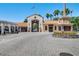 Stonegate Golf Club welcomes golfers and guests through a gated archway to the main building at 663 Shorehaven Dr, Poinciana, FL 34759