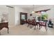 Formal dining room with classic furnishings and large window, perfect for Gathering gatherings at 663 Shorehaven Dr, Poinciana, FL 34759