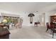 Spacious living room featuring neutral carpeting and elegant furnishings with views to the outside at 663 Shorehaven Dr, Poinciana, FL 34759