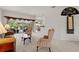 Inviting living room with neutral carpet, white walls, and sliding glass doors leading to the lanai at 663 Shorehaven Dr, Poinciana, FL 34759